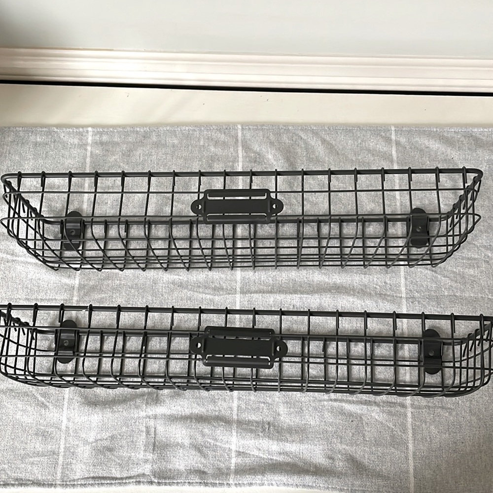 Two black wire shelves 15” long by 6” deep.